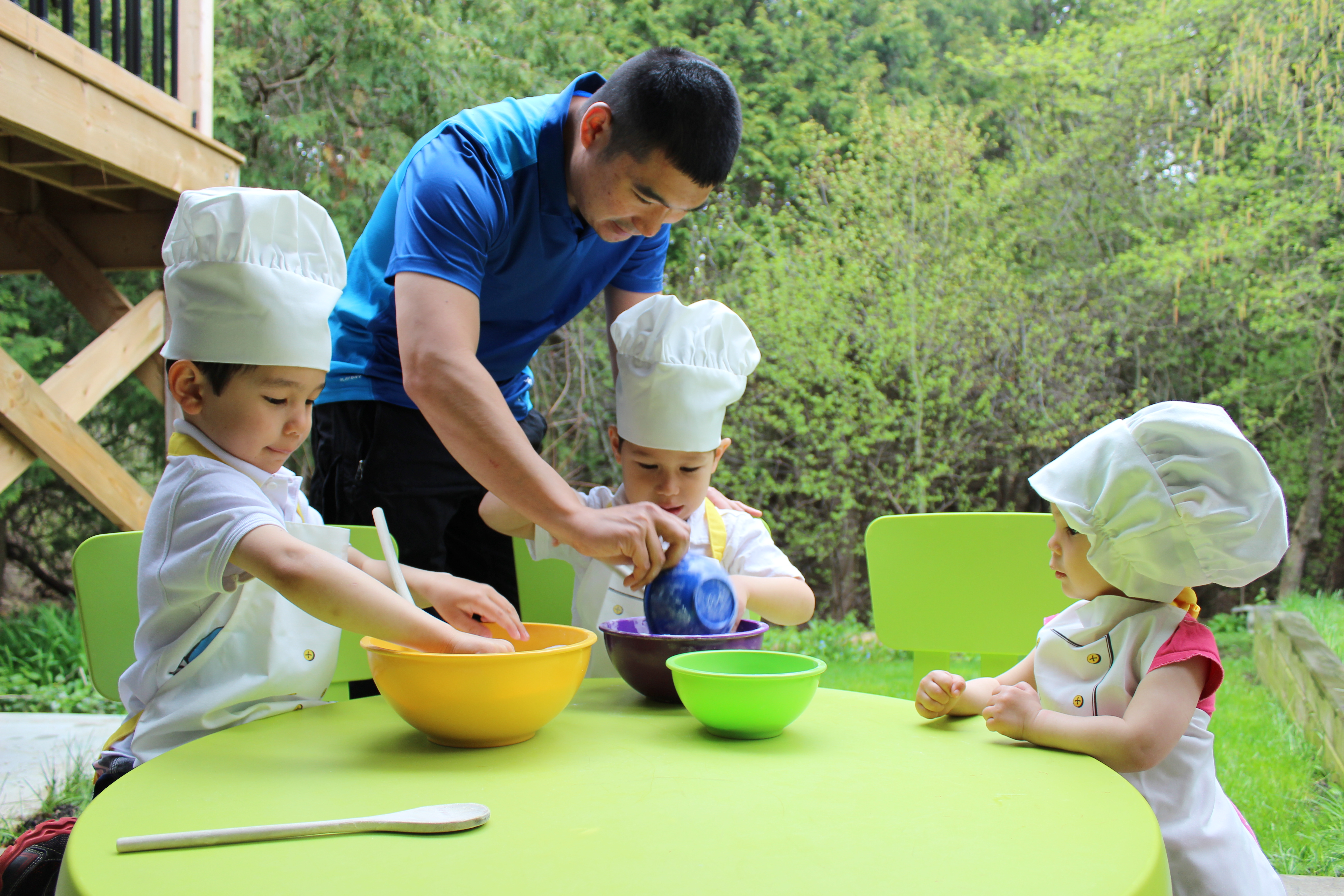 Father preparing dinner for children