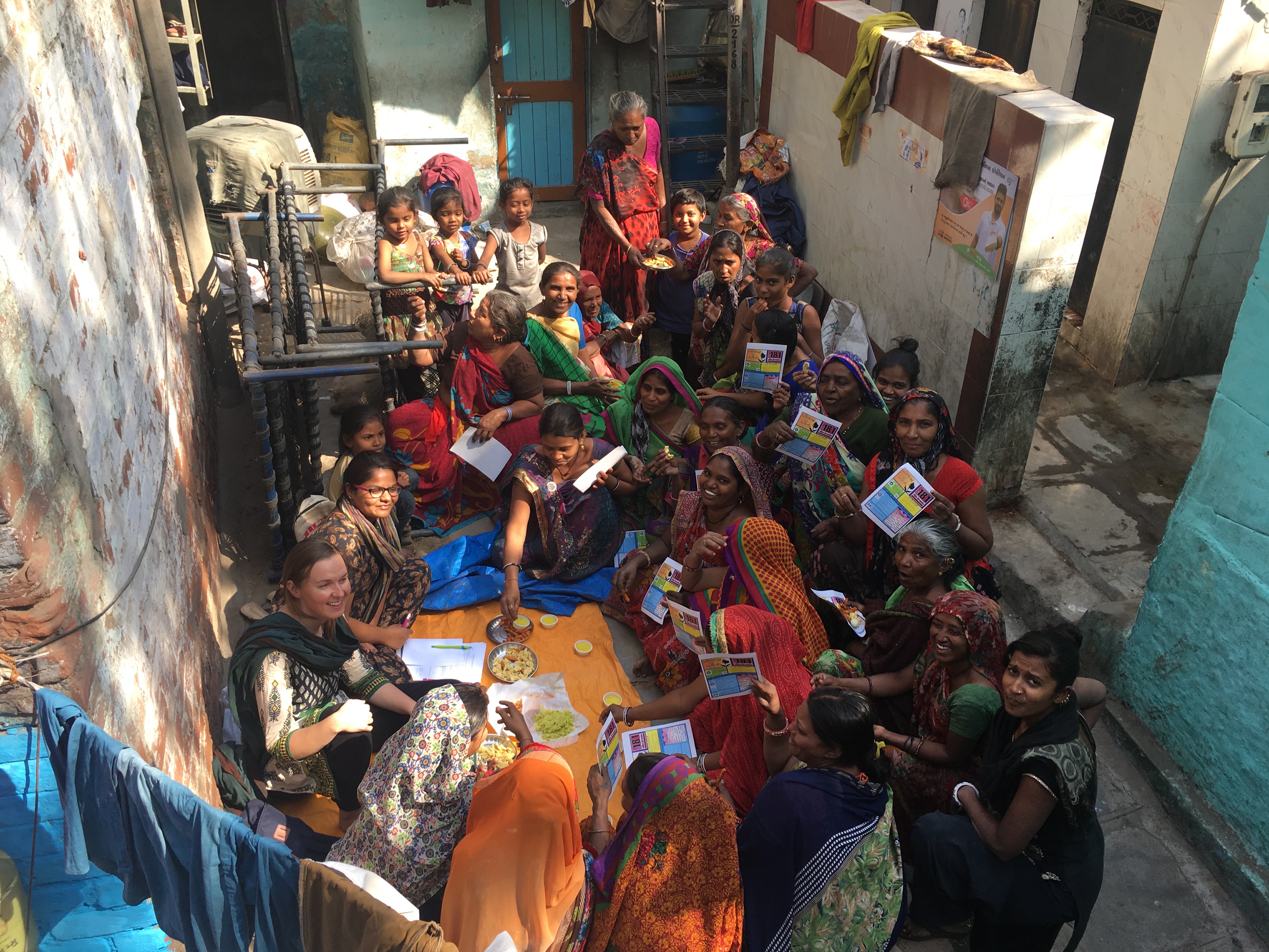 Group of people gathering around food